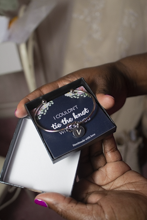 Outstretched hands holding wedding souvenir